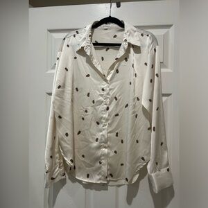 Cream polka dot blouse.